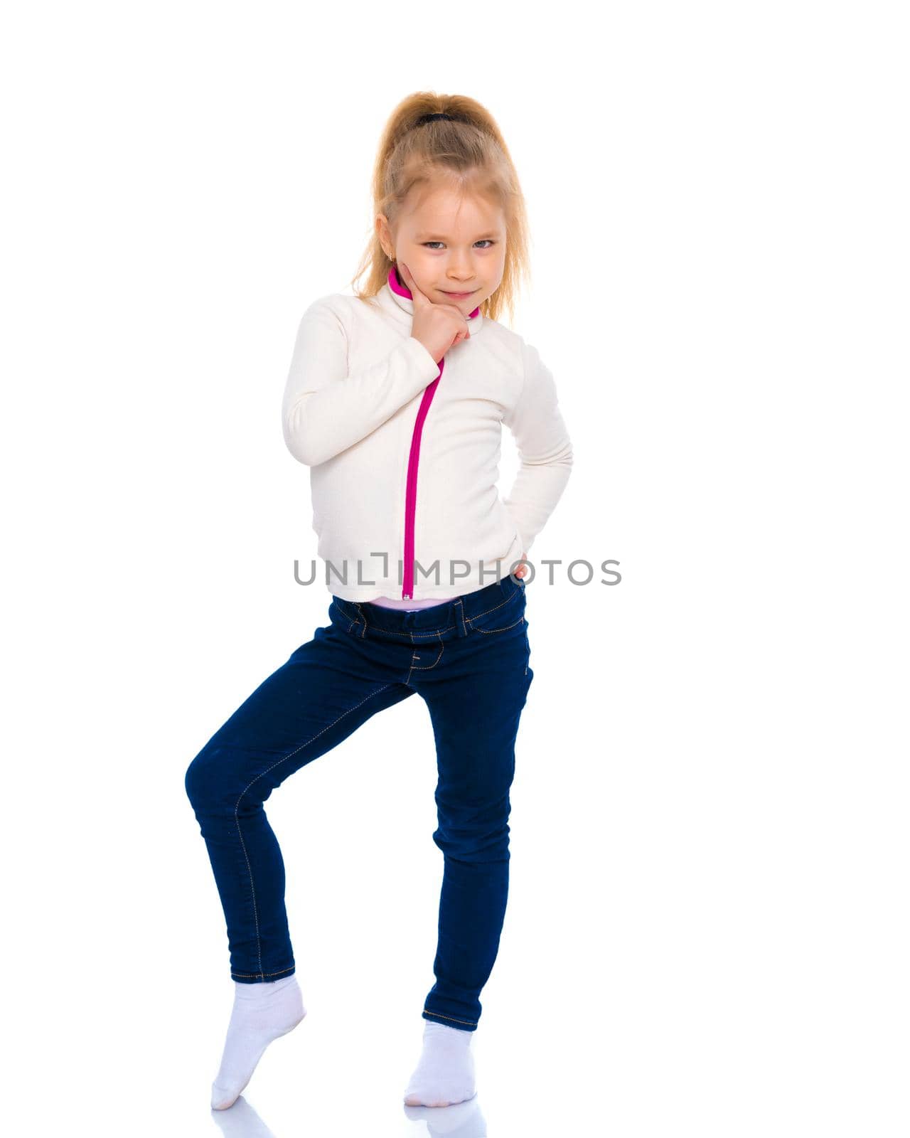 A gymnast girl prepares for the exercise. The concept of childhood and sport, a healthy lifestyle. Isolated on white background.