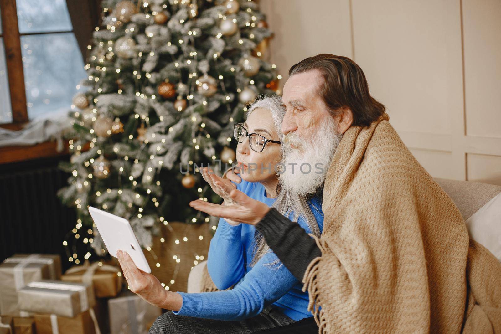 Age and people concept . Senior couple at home. People with tablet.