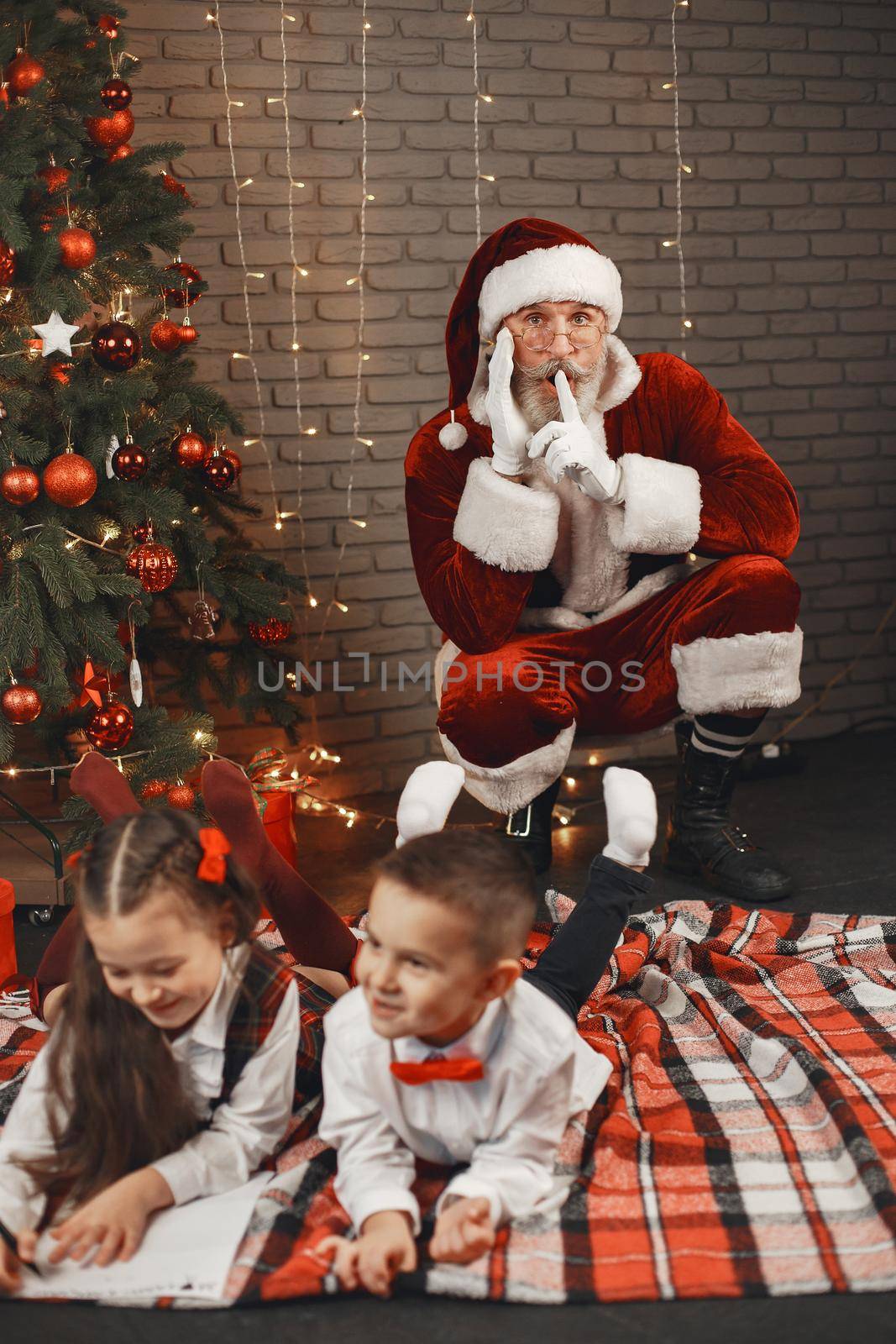 Children at home, decorated for Christmas. Santa's mail.