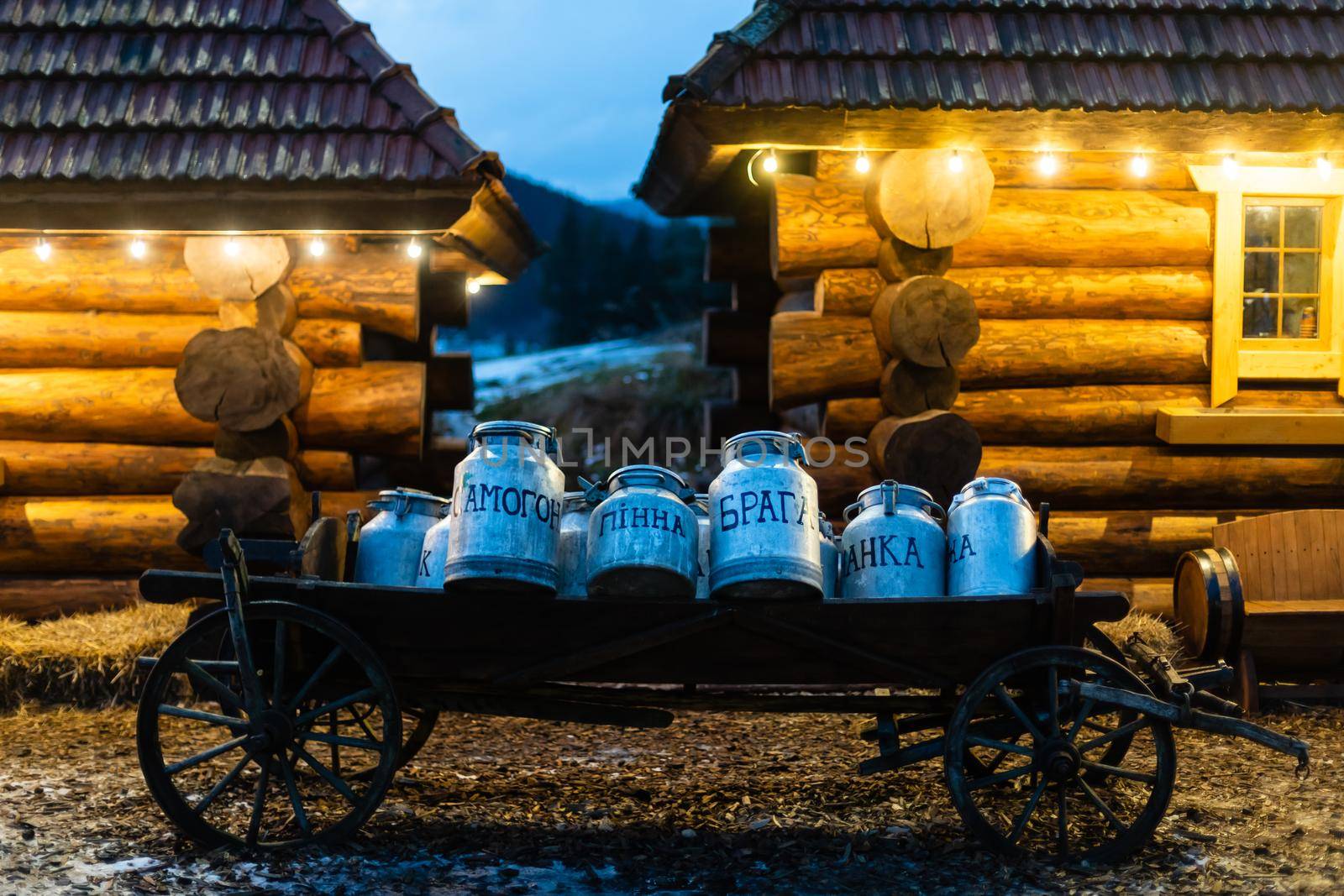 Vintage milk churns on railway platform.