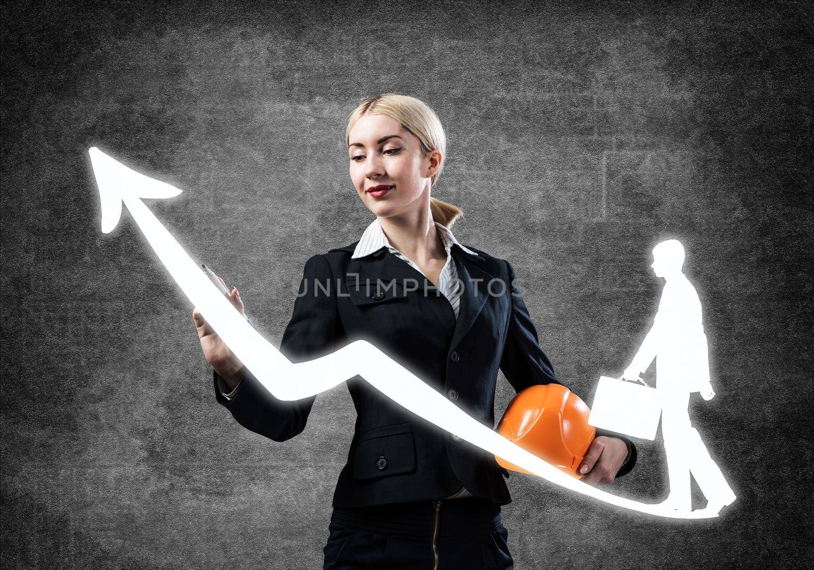 Business lady drawing success graph. Development of successful professional career. HR specialist in business suit with safety helmet. Recruitment agency presentation. Human resource management.