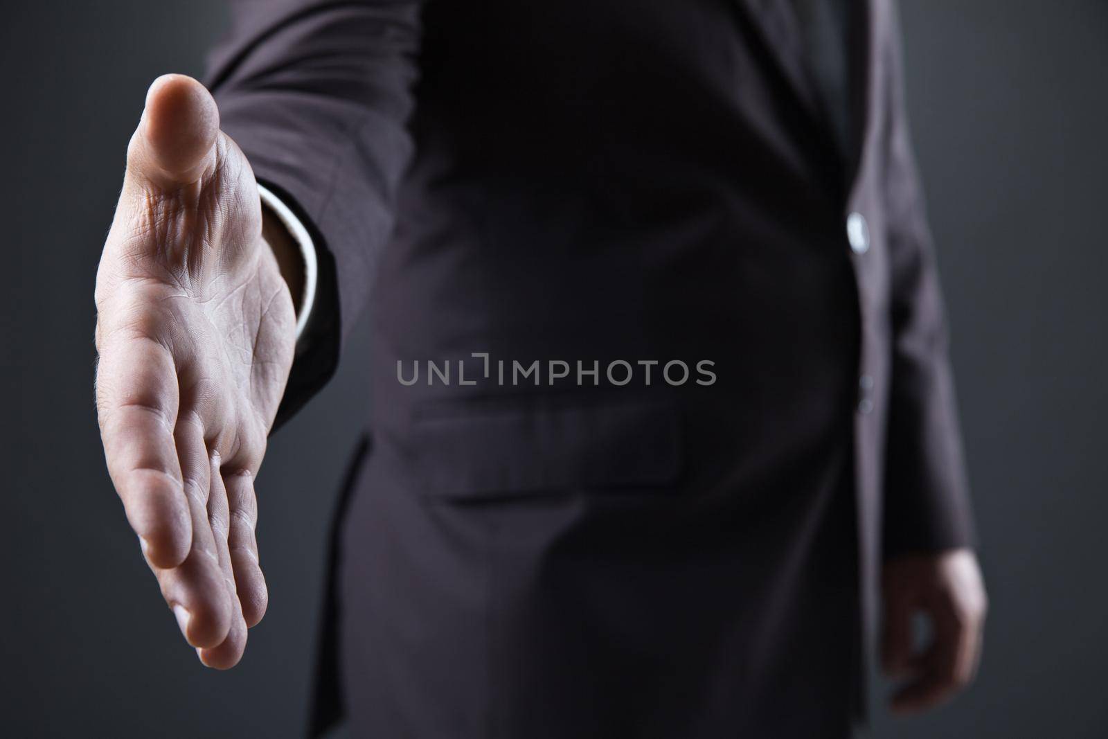 business man with open hand ready to seal deal by Julenochek