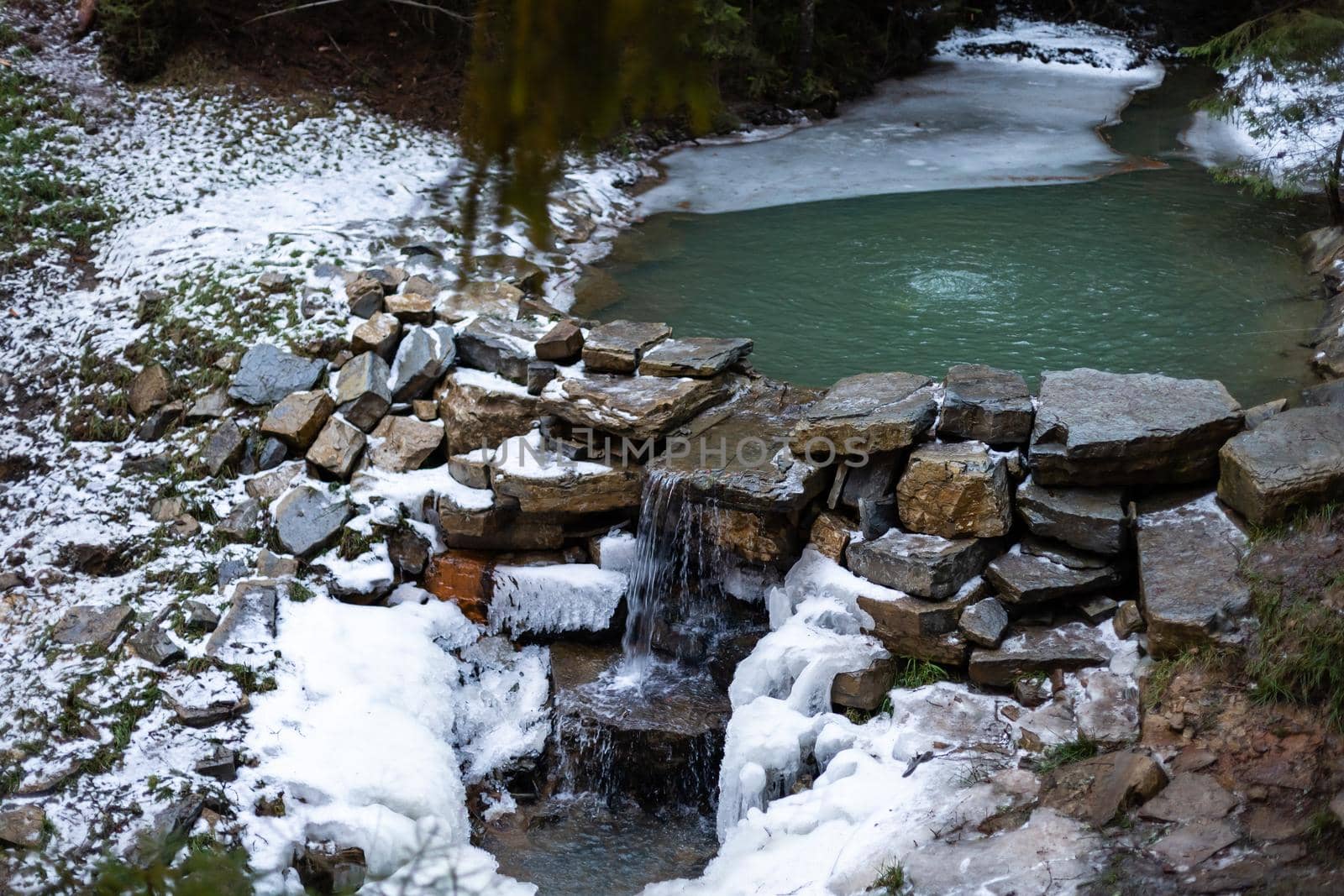 Frozen river in winter landscape.