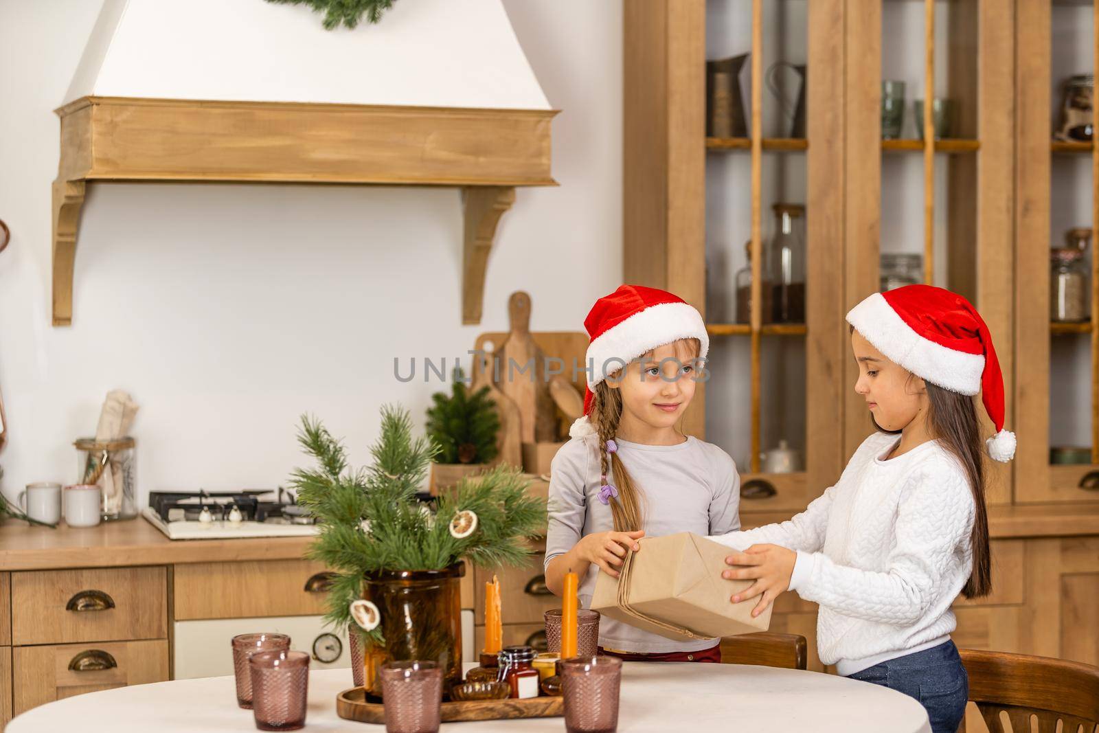 Two little girls with a christmas present