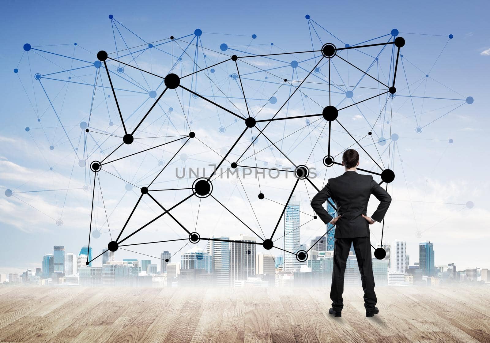 Businessman standing with back and looking at network drawn concept