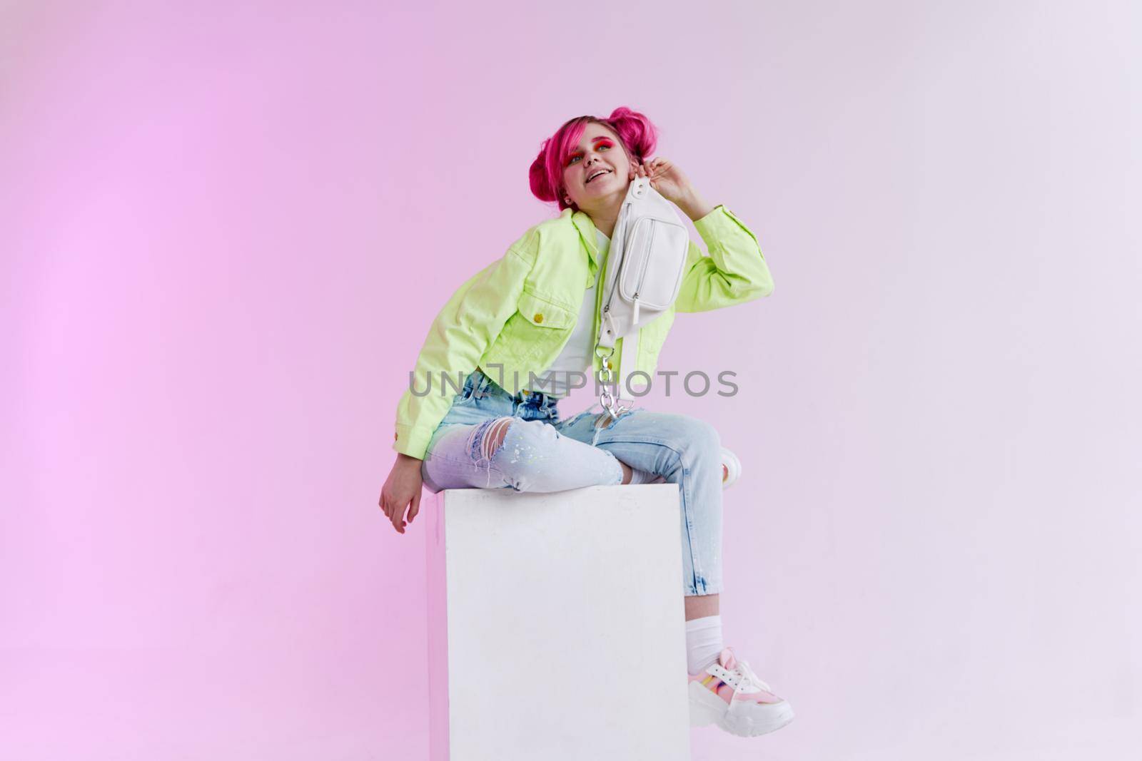 pretty woman with pink hair creative neon background. High quality photo