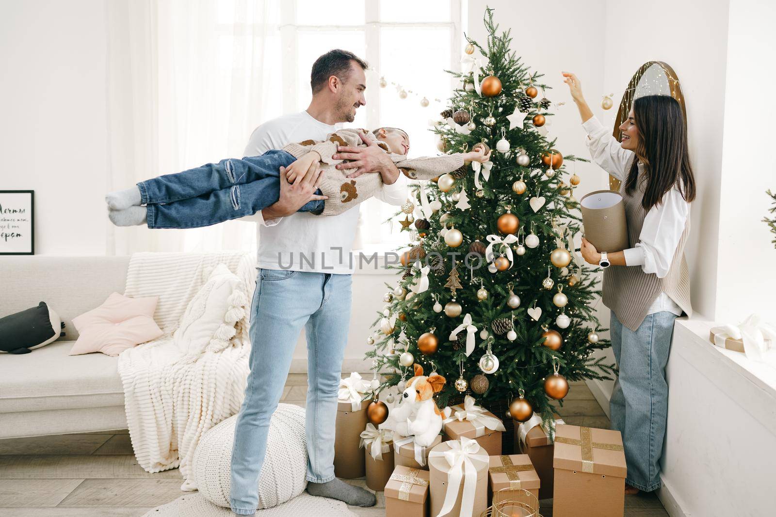 Happy family making Christmas decorations at home together, portrait