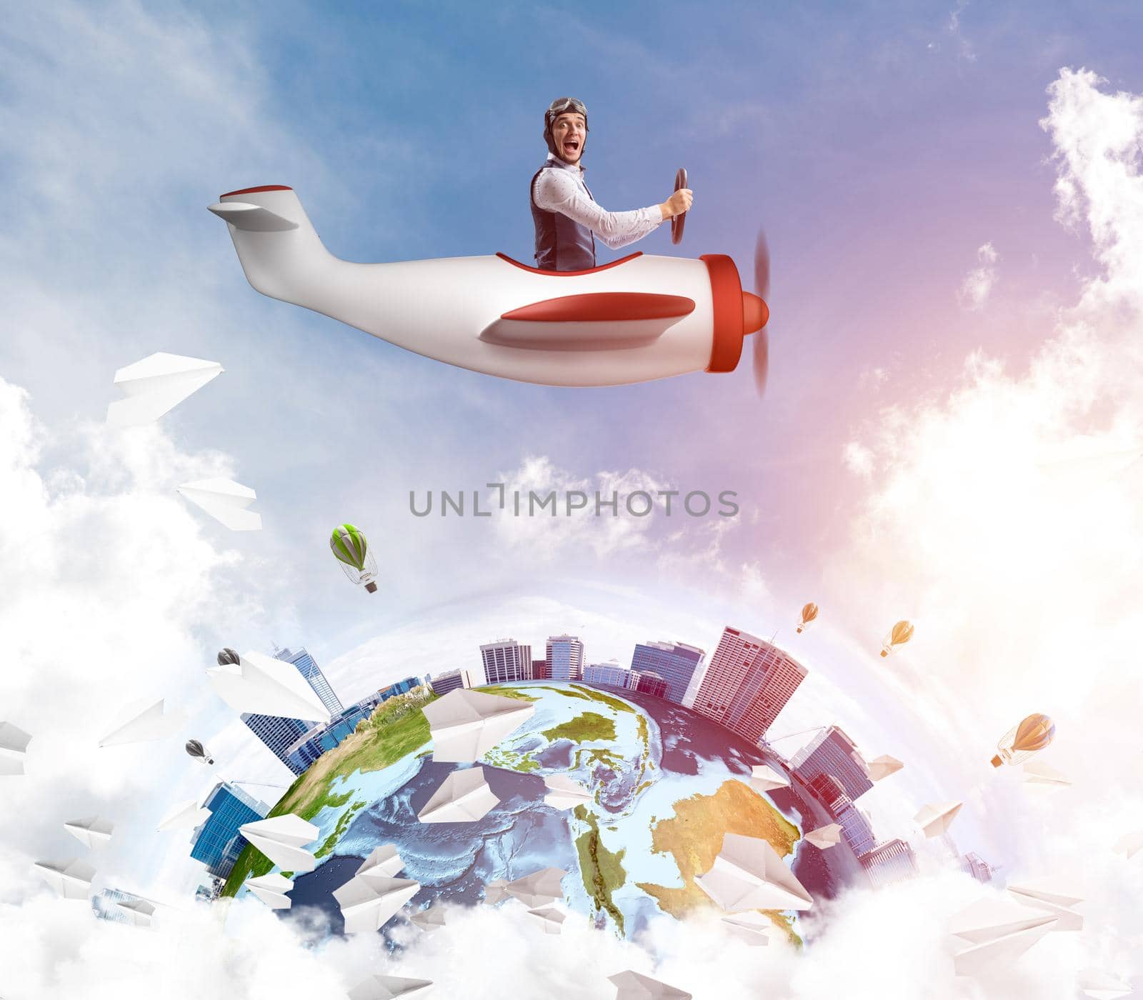 Man in aviator hat with goggles driving propeller plane. Earth globe with high modern buildings. Funny man having fun in small airplane. Blue cloudy sky with flying hot air balloons and paper planes