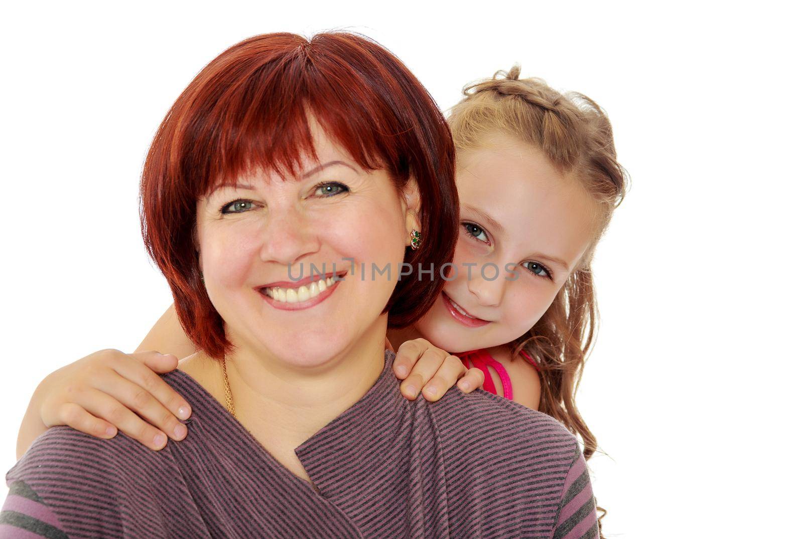 Happy family of two people,an adult mother, her beloved daughter 7 years. Daughter gently hugs the mother's neck. Close-up.Isolated on white background.