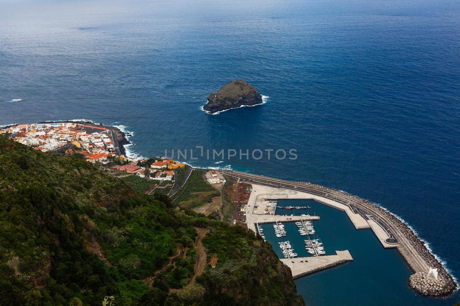 An island in the middle of a body of water. High quality photo