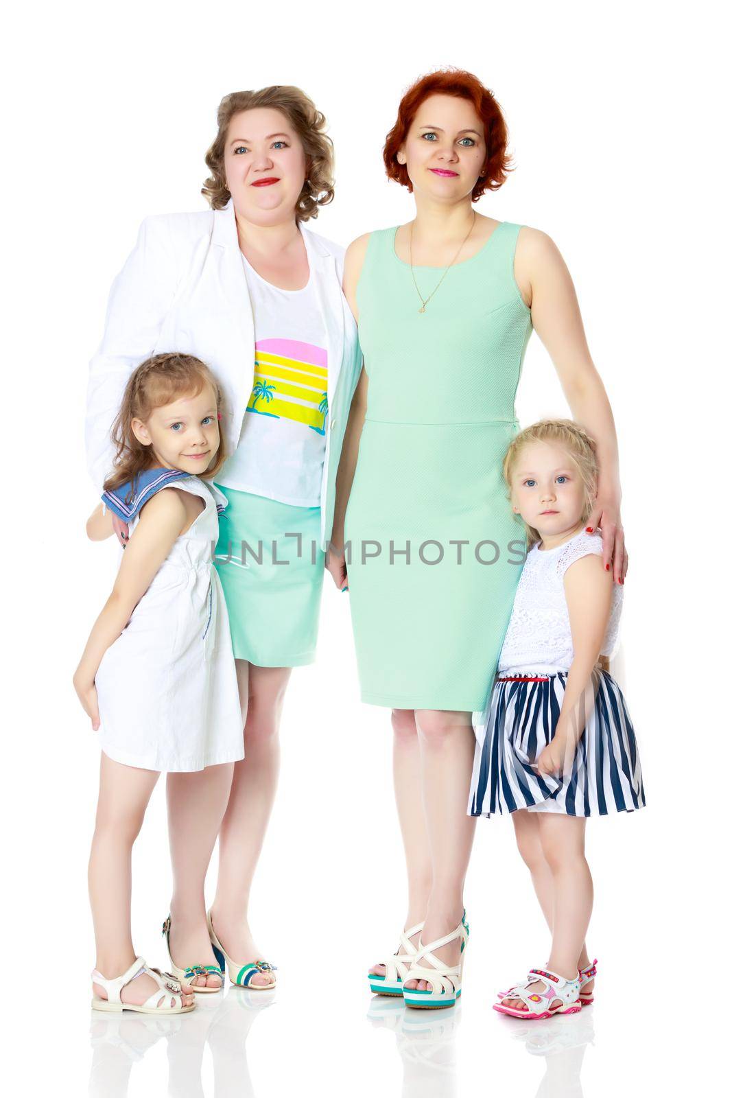 Happy family with young children. The concept of family happiness and development of children. Isolated on white background.