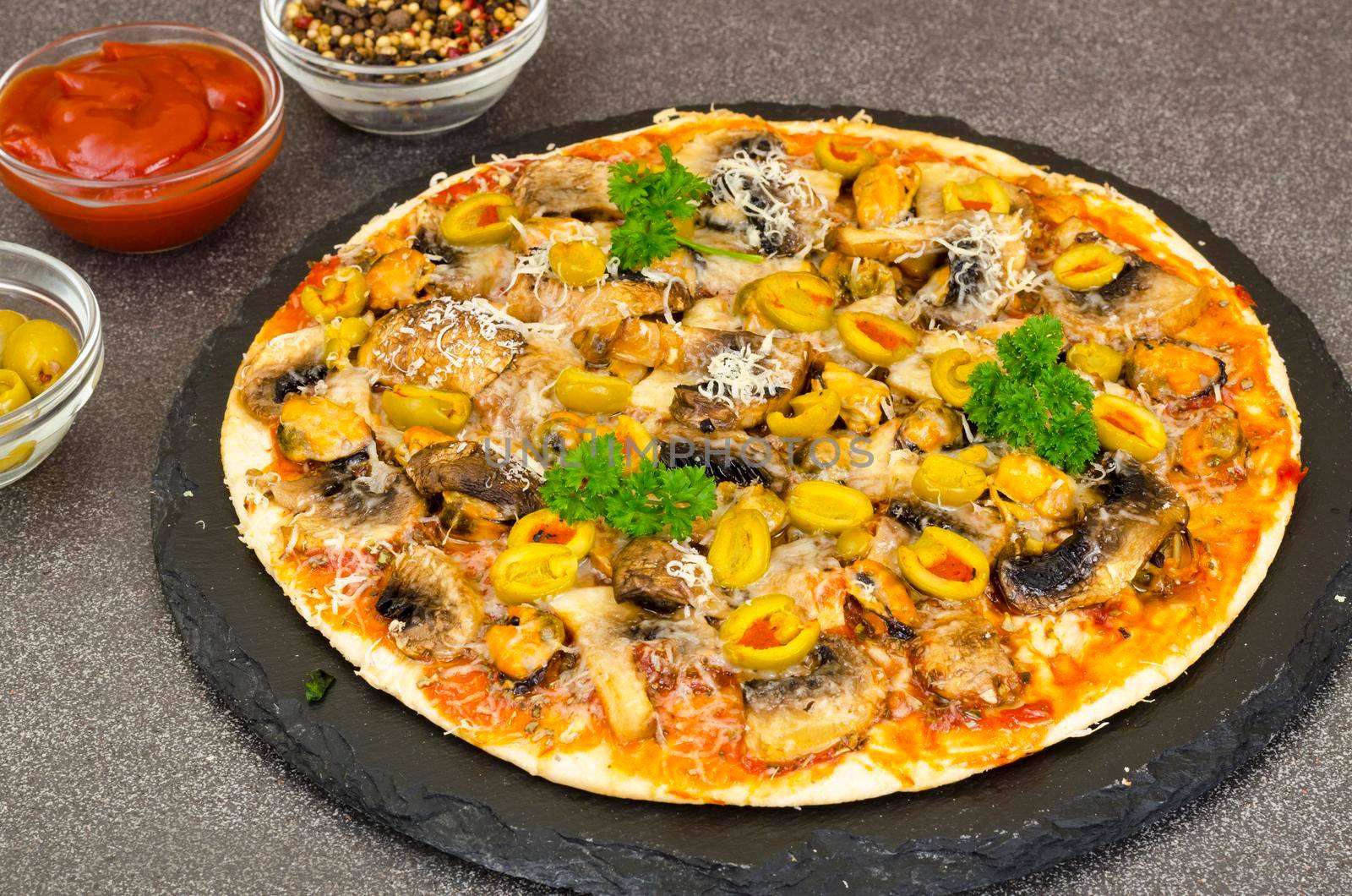 Pizza with mussels, mushrooms, green olives. Studio Photo by ArtCookStudio