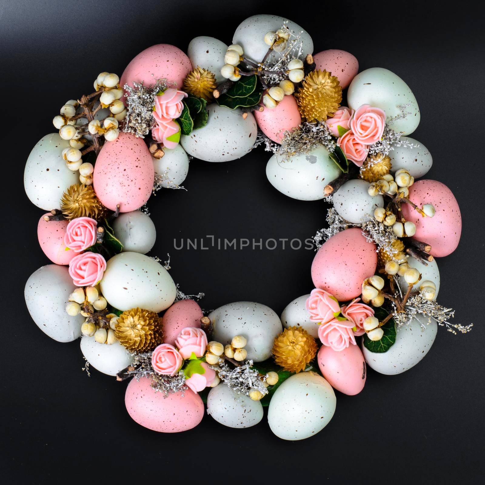 Easter wreath of colorful decorative eggs, flowers by ArtCookStudio