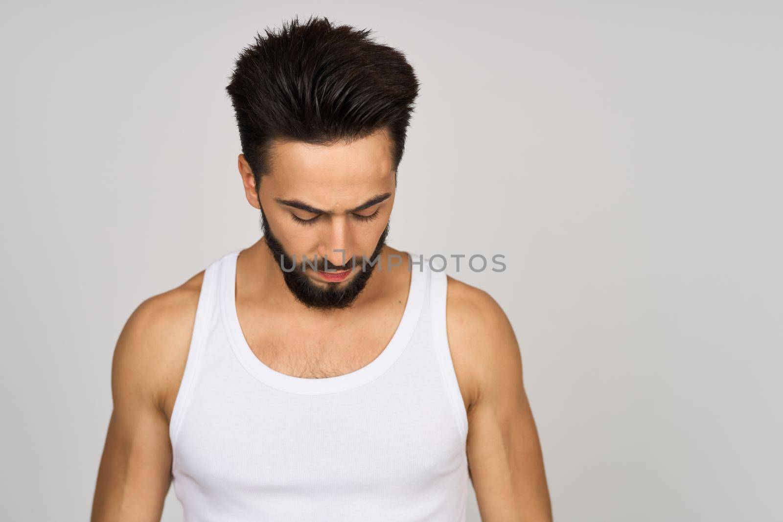 cute bearded man in white studio tank top by Vichizh