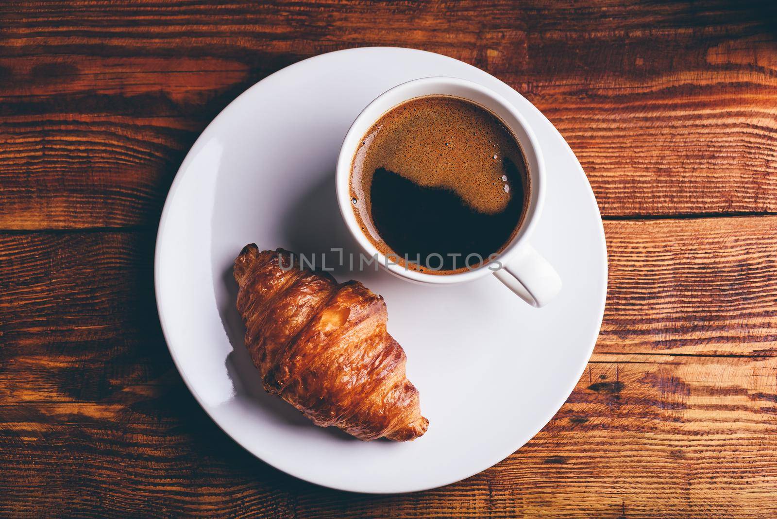 Fresh Croissant and Cup of Black Coffee by Seva_blsv