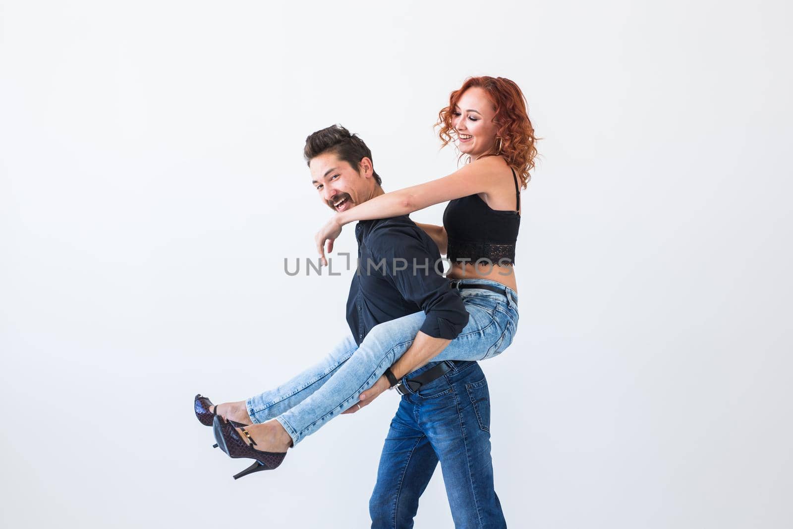 Friendship, people concept - young woman jumped on the man's back by Satura86