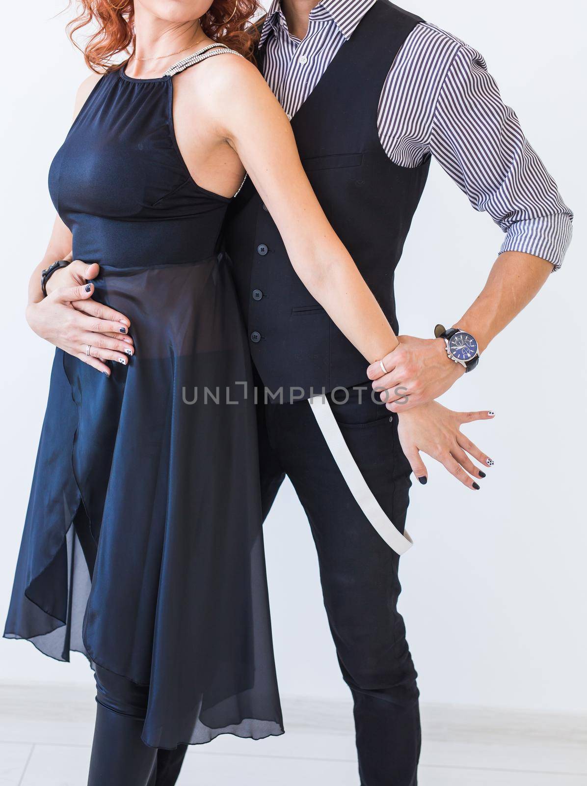 Social dance, kizomba, tango, salsa, people concept - close up of beautiful couple dancing bachata on white background by Satura86
