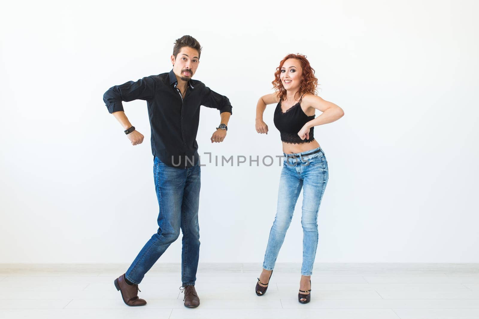 Social dance concept - Crazy dancing, cheerful couple over white background by Satura86