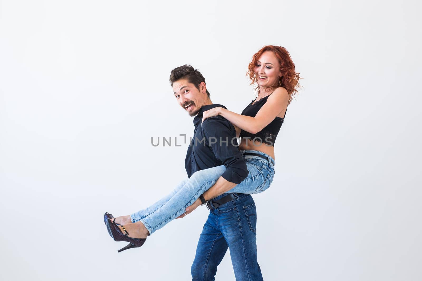 Friendship, people concept - young woman jumped on the man's back by Satura86