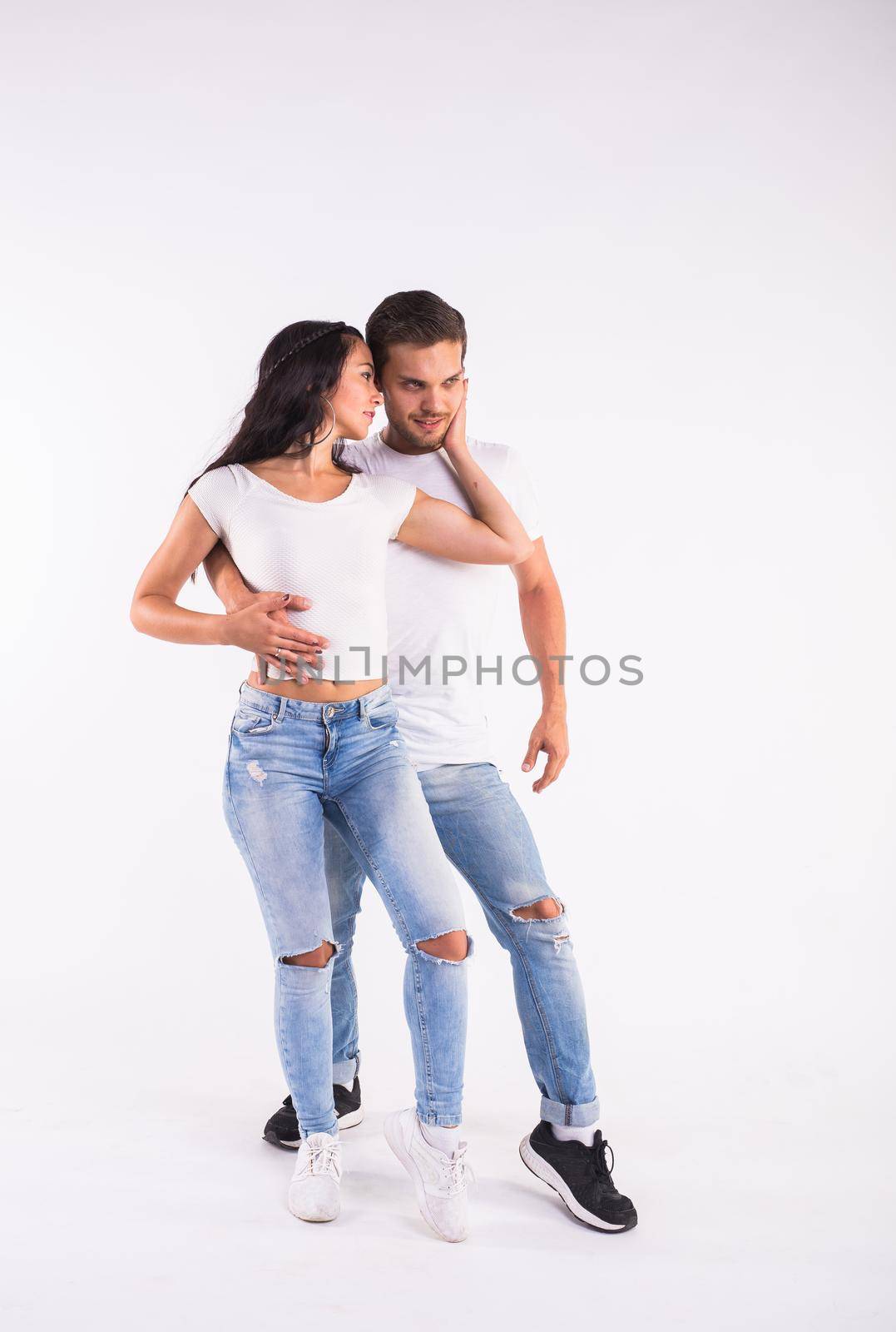 Passionate couple dancing social danse kizomba or bachata or semba or taraxia on white background by Satura86