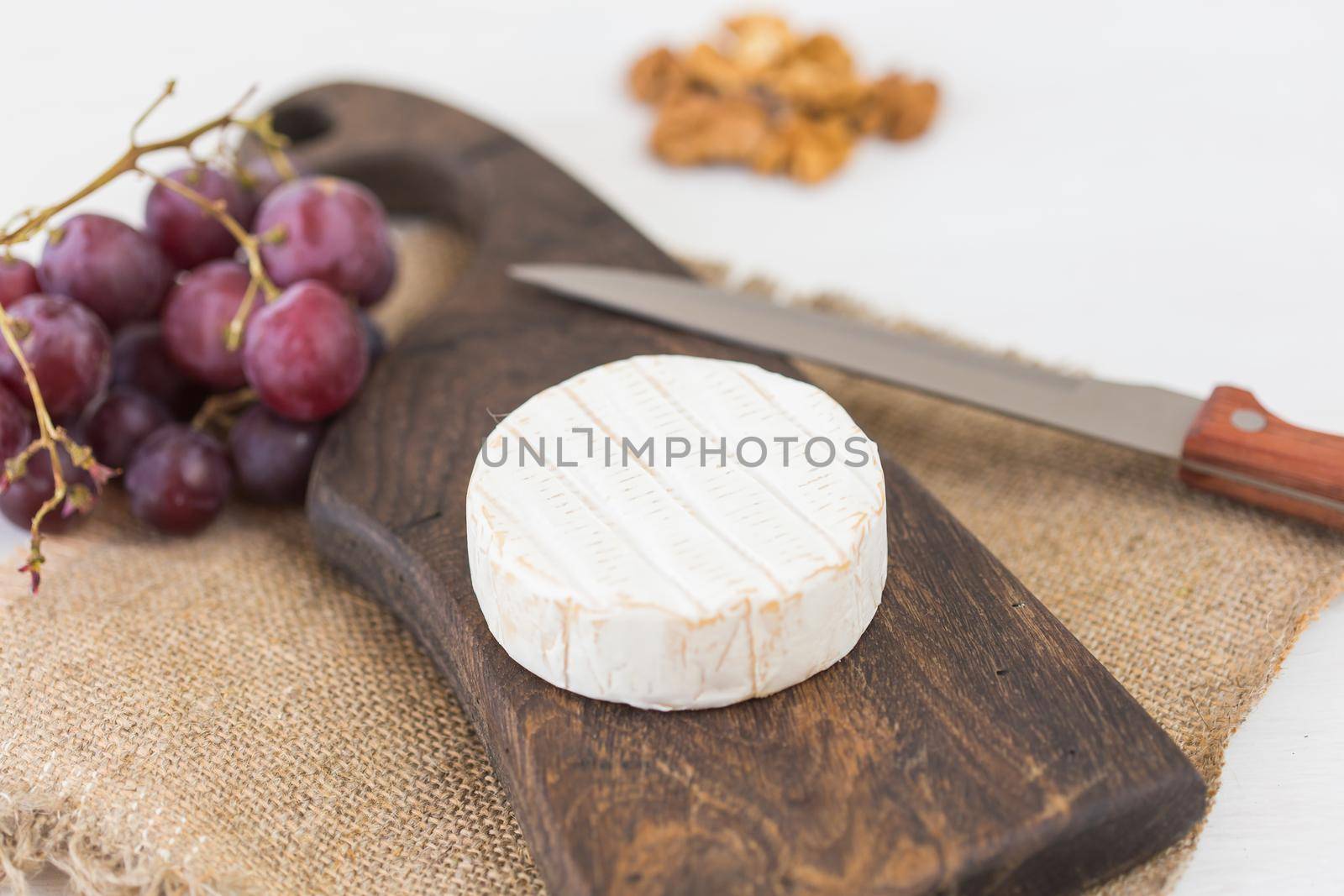 Blue cheese or brie with grapes and nuts.