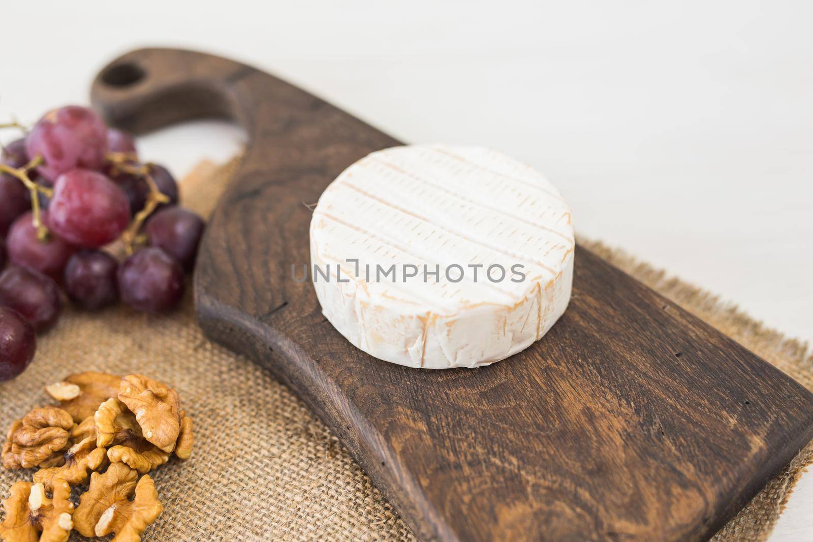 Blue cheese or brie with grapes and nuts by Satura86