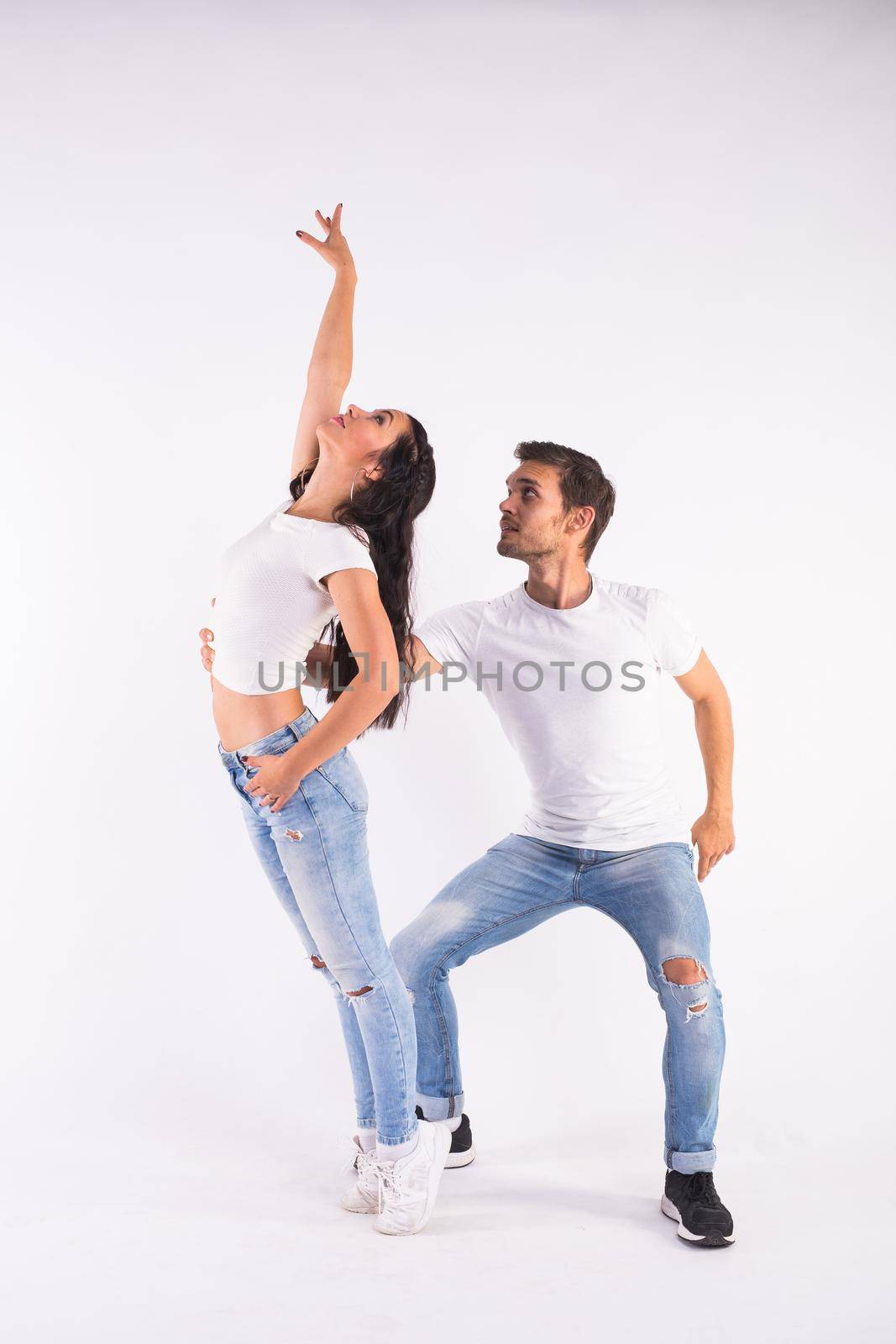 Salsa, kizomba and bachata dancers on white background. Social dance concept by Satura86