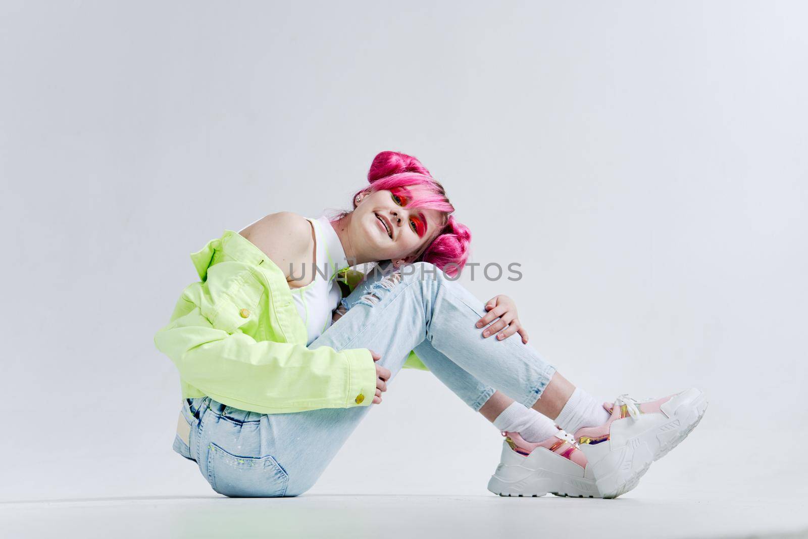 woman with pink hair teen fashionable clothes posing neon. High quality photo