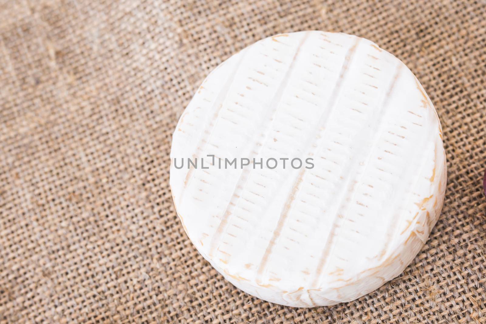 Camembert cheese. Fresh Brie cheese on a rustic background top view by Satura86