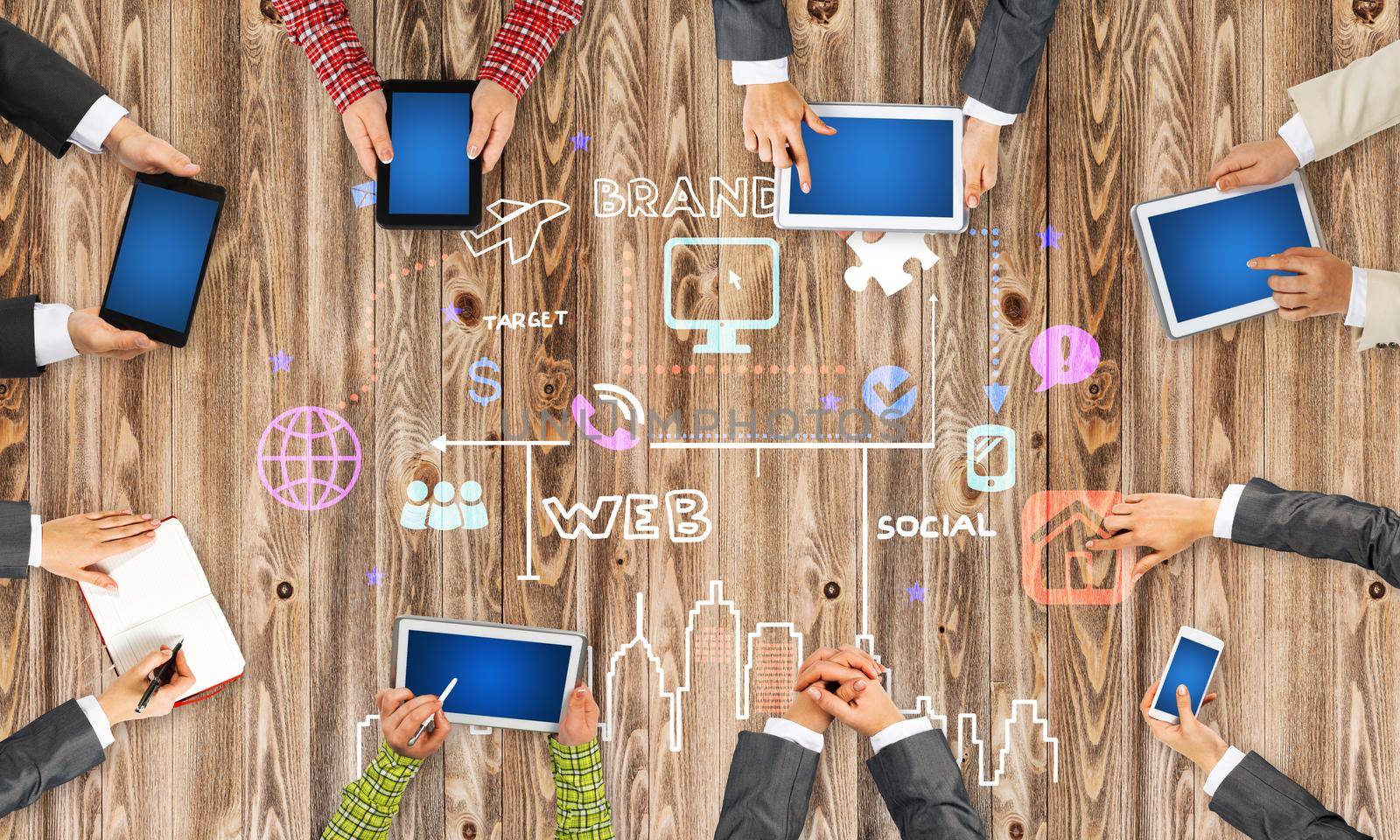 Group of people with devices in hands working together as symbol of networking and communication