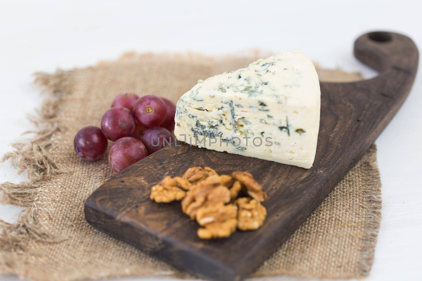 Blue cheese or brie with grapes and nuts.