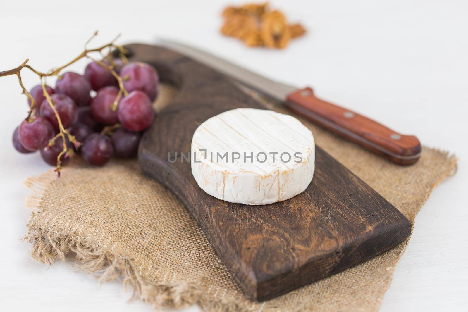 Blue cheese or brie with grapes and nuts.