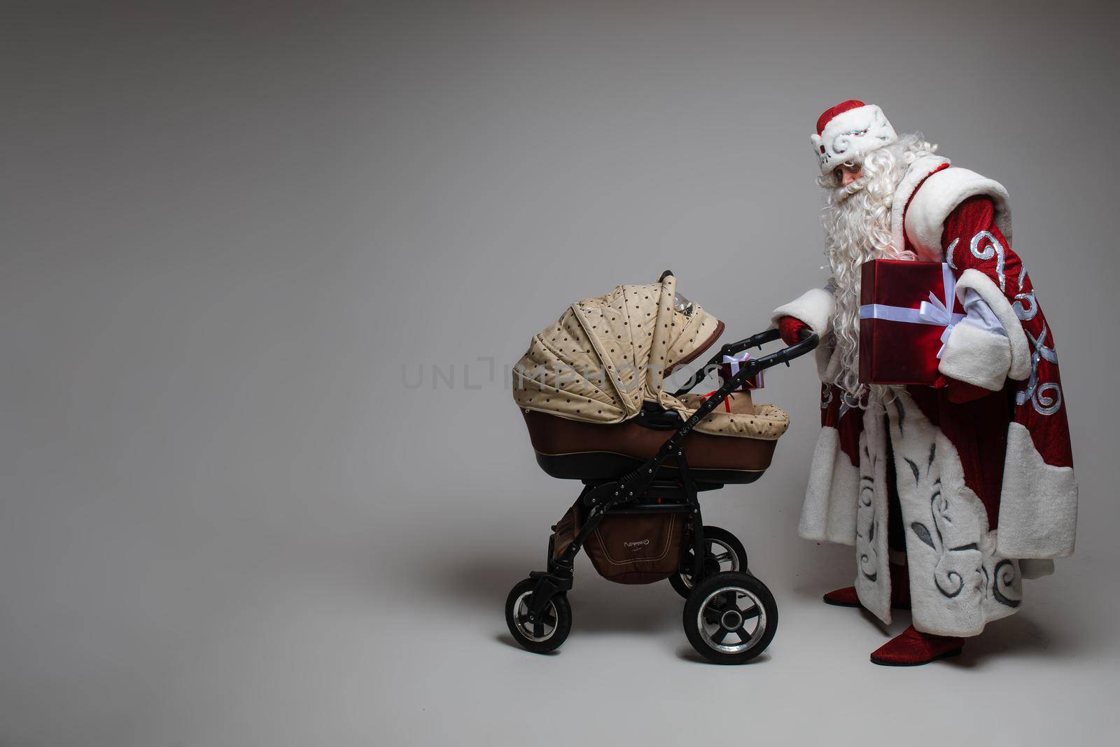 portrait of winking father frost, picture isolated on grey background