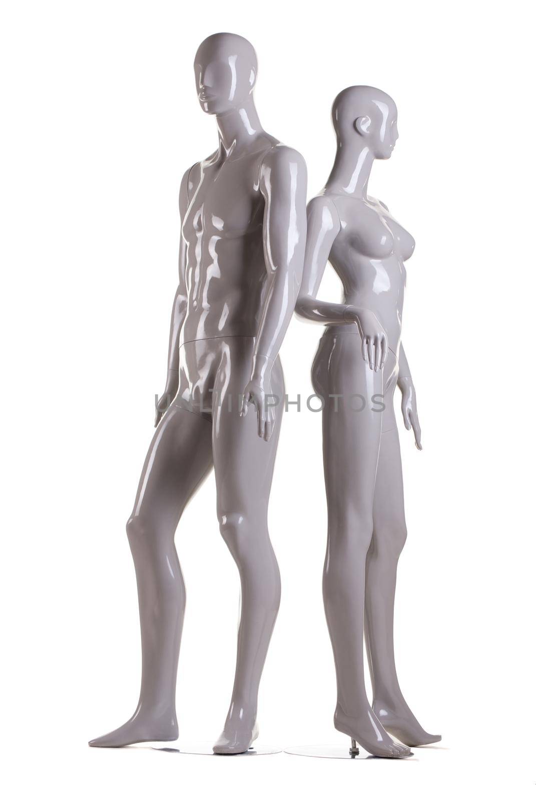 Couple of male and a female fashion mannequin on white background