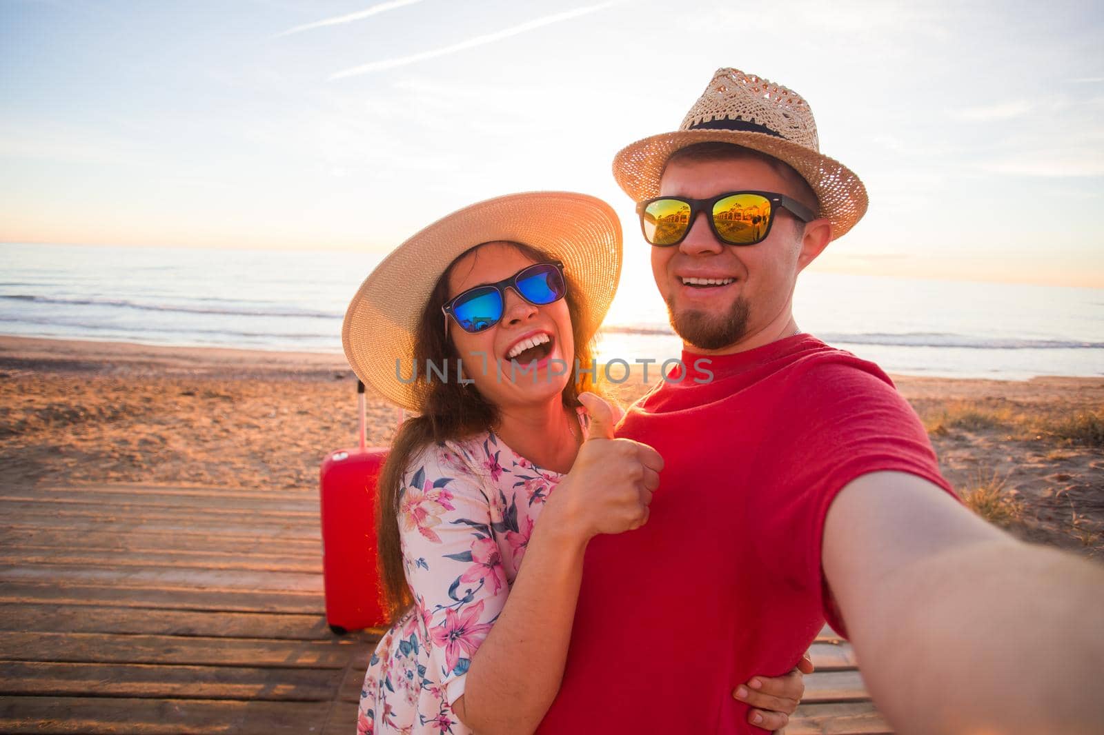Travel, summer and holiday concept - Lovely couple taking selfie on a beach by Satura86