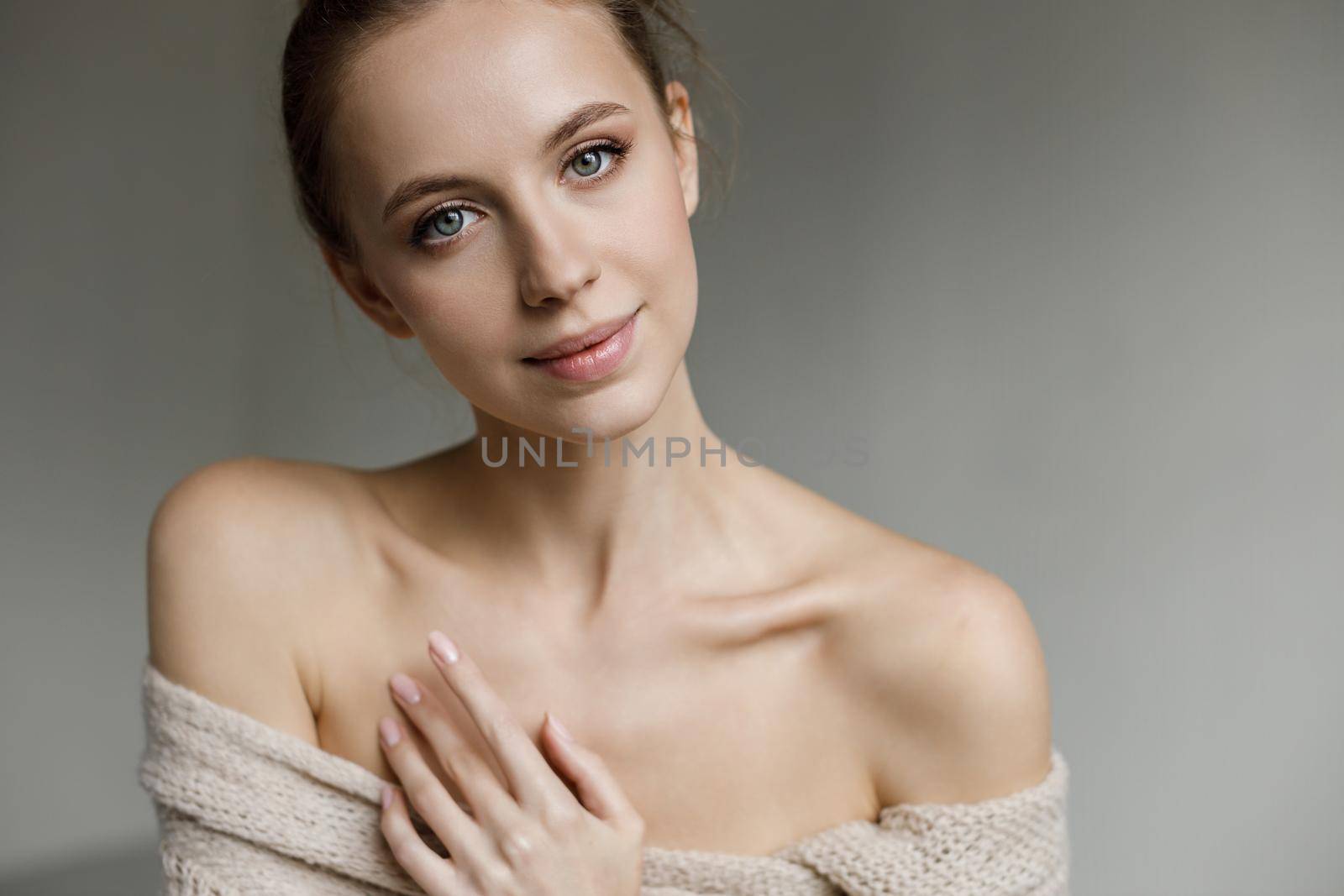 Portrait of a young pretty woman indoor in studio, skin wellness. High quality photo