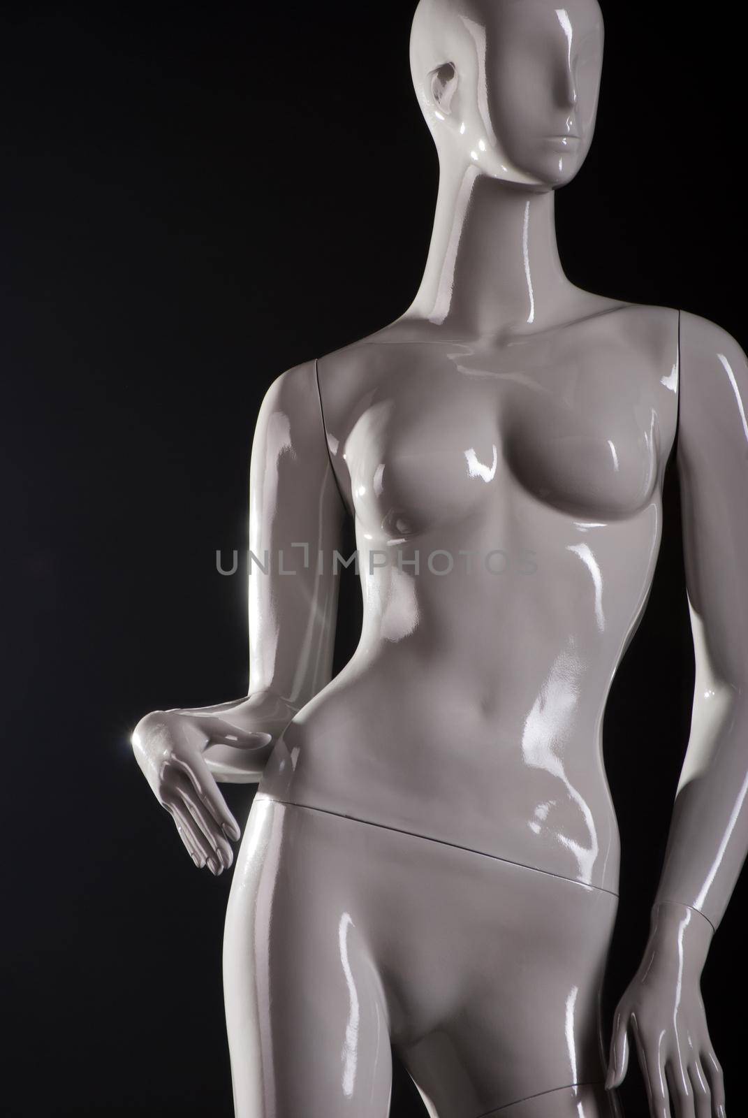 Female fashion mannequin against a black background