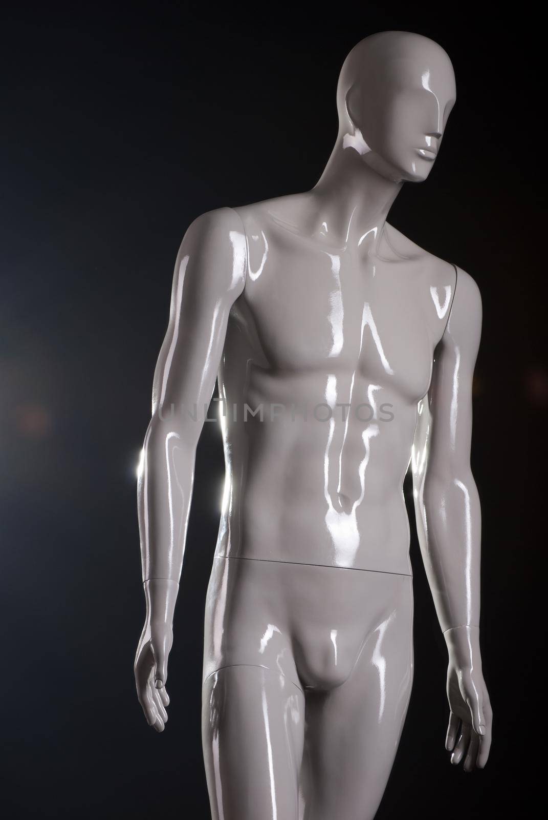 Male fashion mannequin against a black background