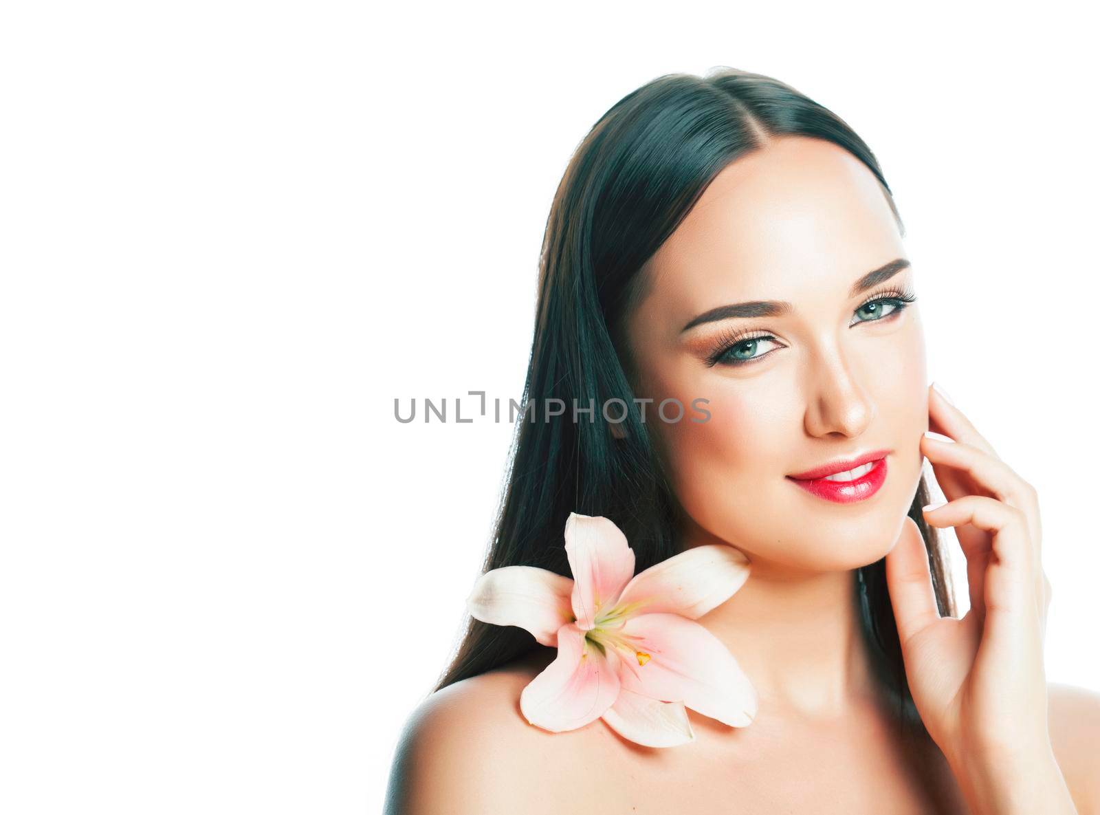 young attractive lady closeup with hands on face isolated flower lily brunette spa nude makeup, beauty concept