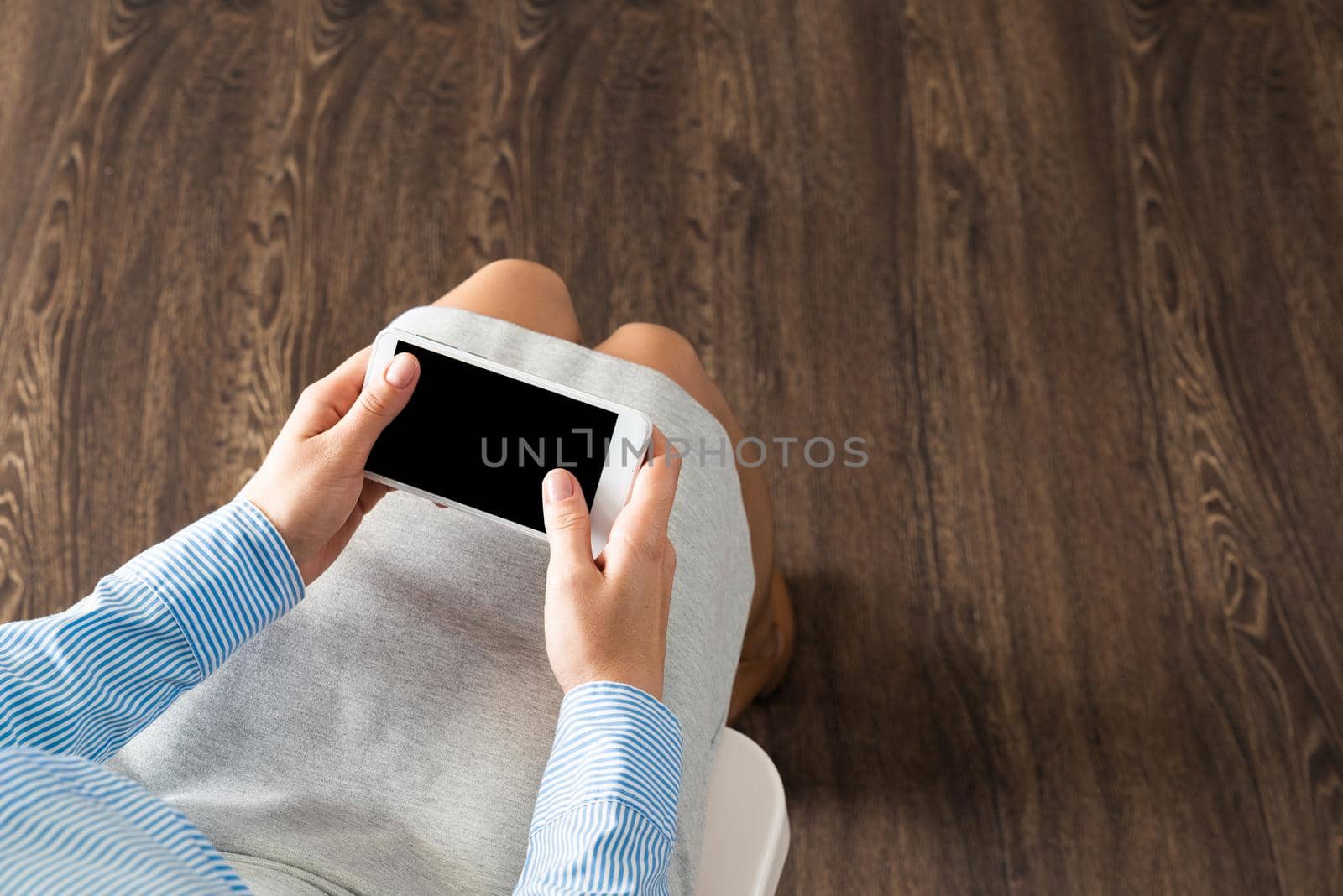 close-up of female hands with a phone