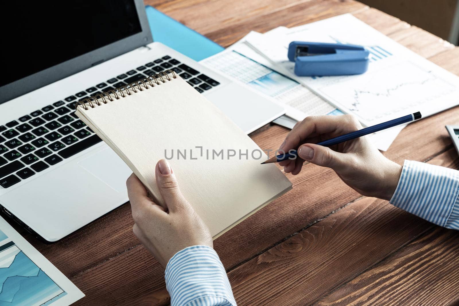 woman with notepad in the office by adam121