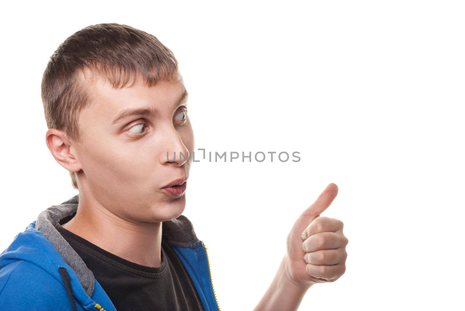 Portrait of a handsome young man, thumbs up over white background