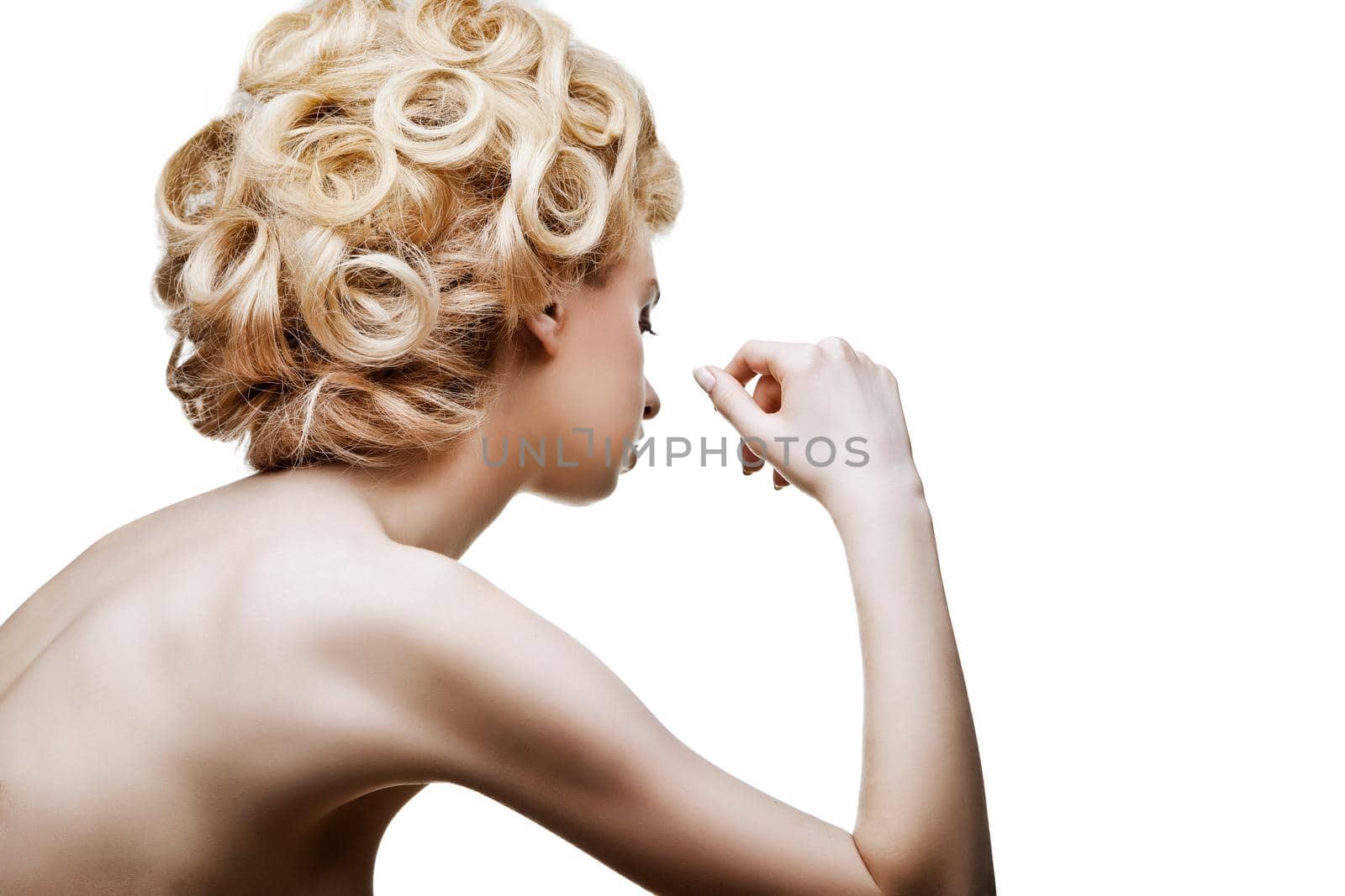 Beautiful high fashion female model with abstract hair style isolated