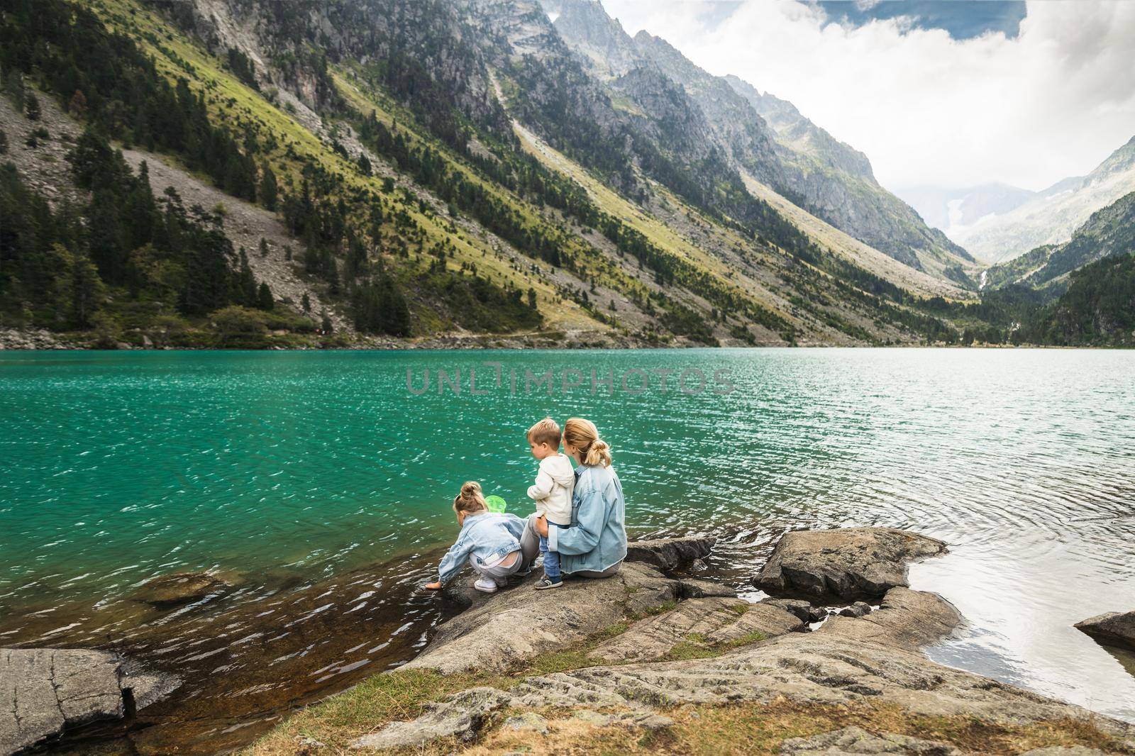 Family near a french lake Gaube at the high pyrenees