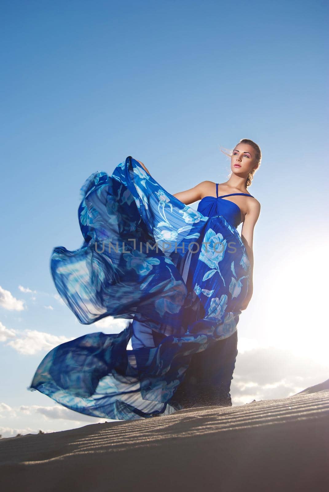 beauty woman in blue dress on the desert by Julenochek