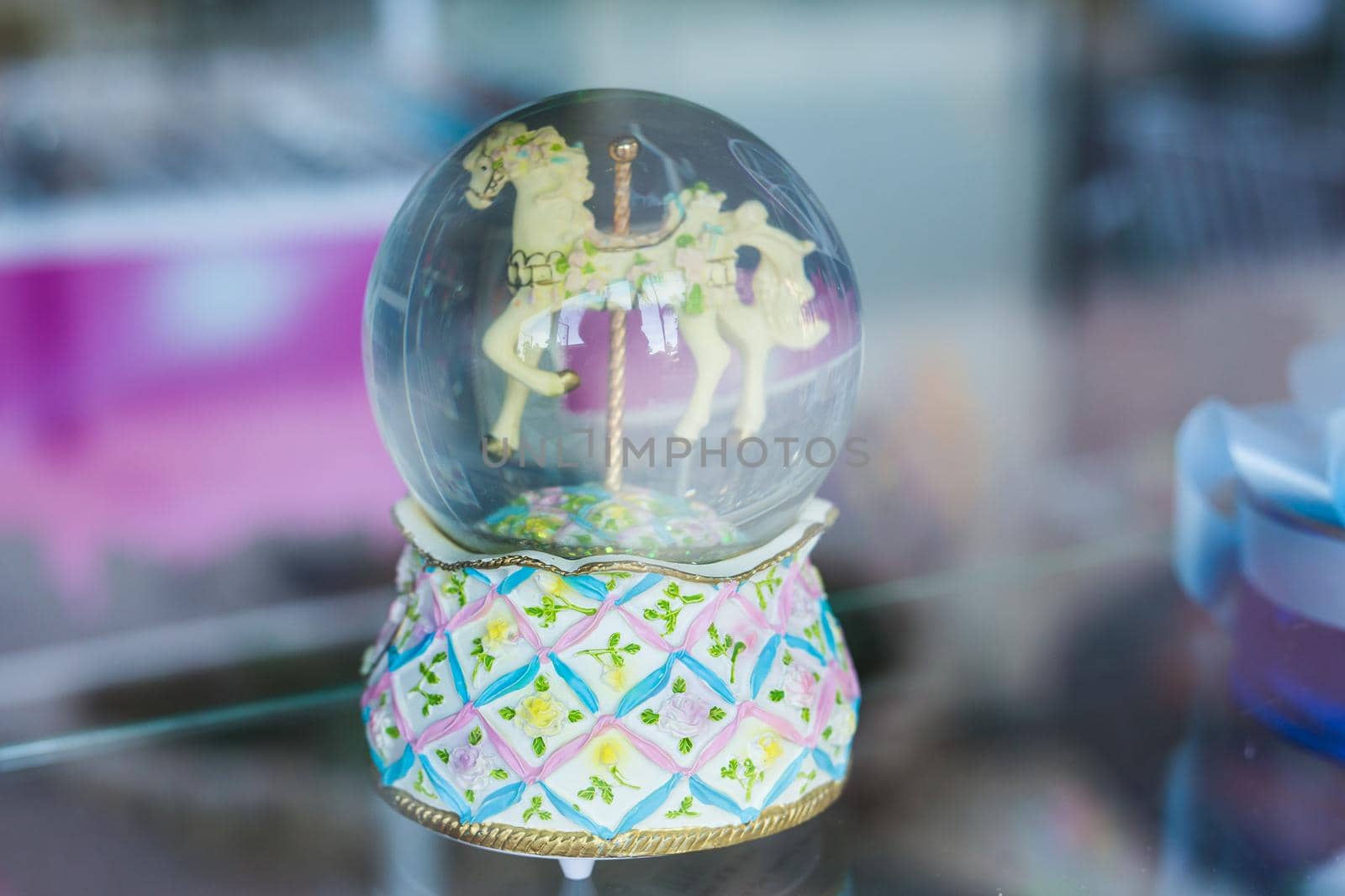 Snowy Glass Ball with toy horse inside.