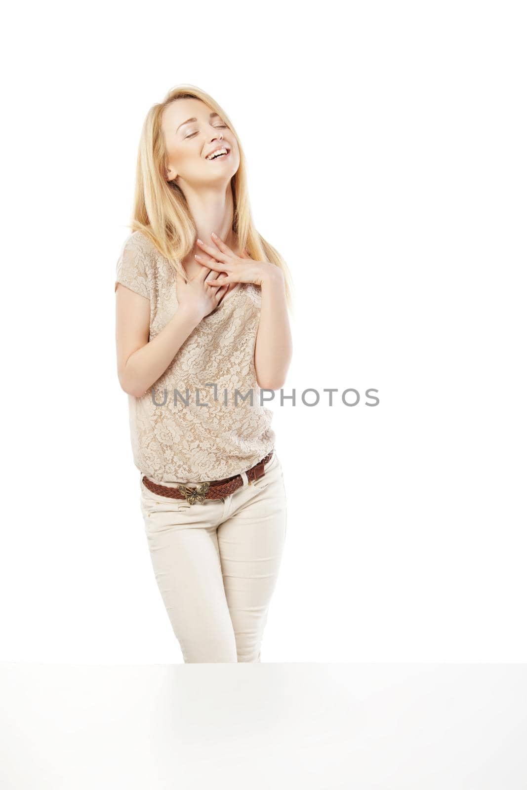 Young excited woman looking at the shop window isolated over white