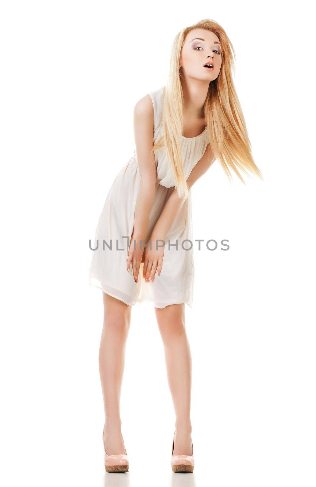 Portrait of beautyful smiling and looking at the camera woman with long hair on white background