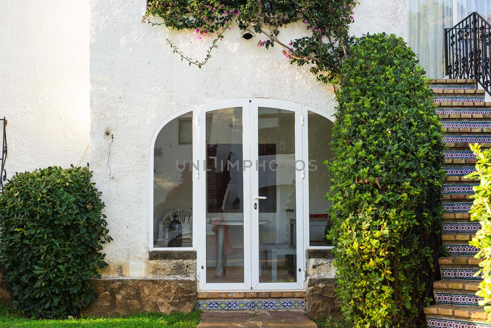 Beautiful exterior of newly built luxury home. Yard with green grass and walkway by Satura86