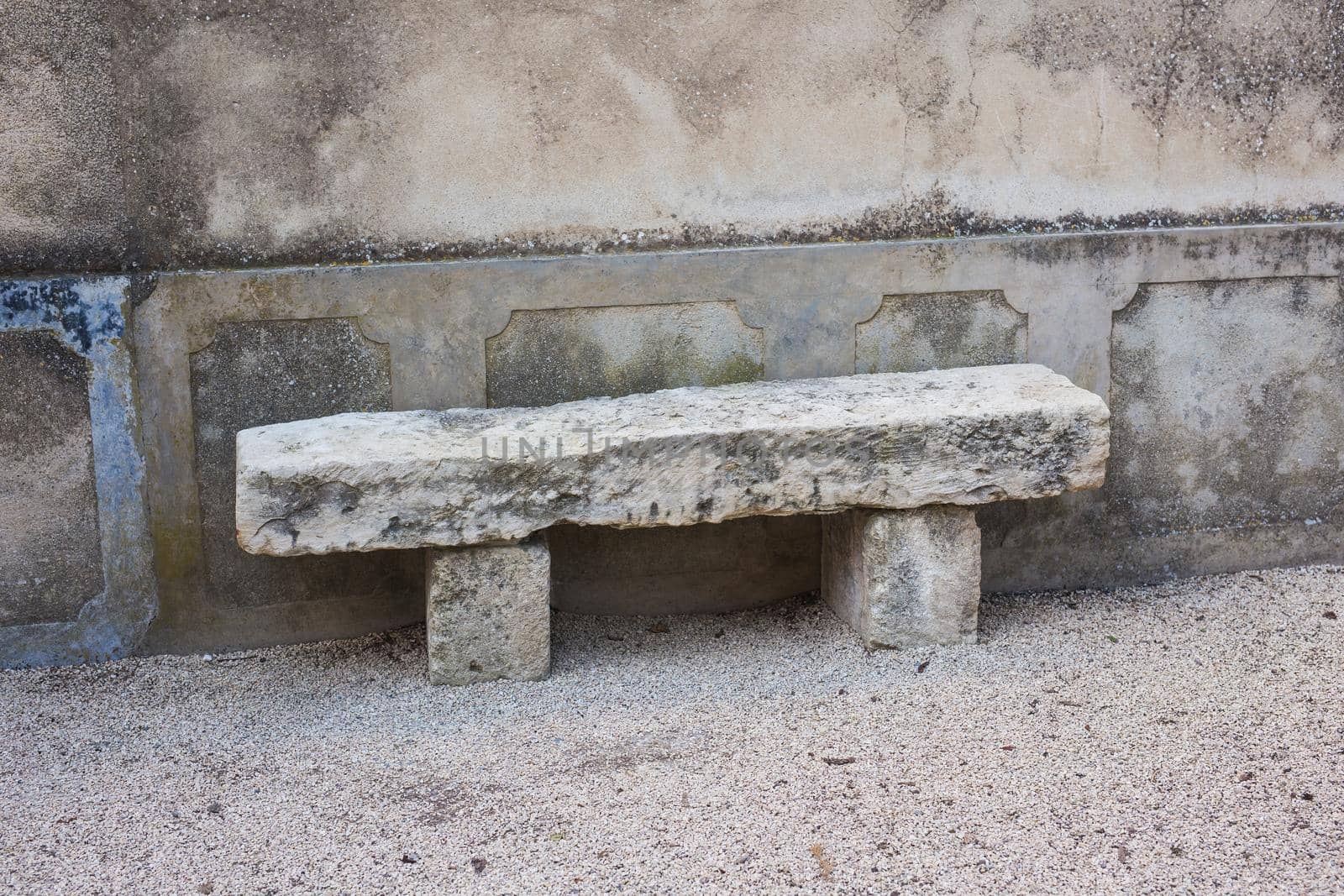 Stone bench in the city park outdoors.